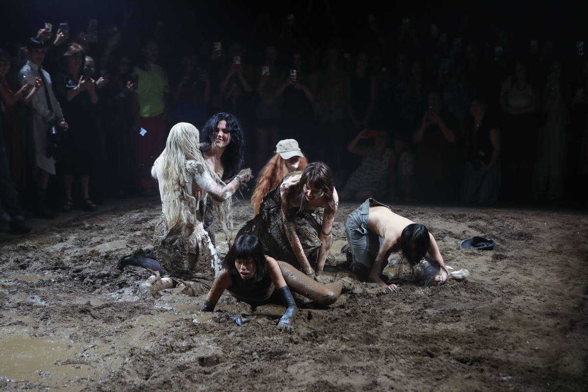 Models mud wrestling at Elena Velez’s Spring/Summer 2024 presentation, The Longhouse. Photo by Jonas Gustavsson for The Washington Post via Getty Images.