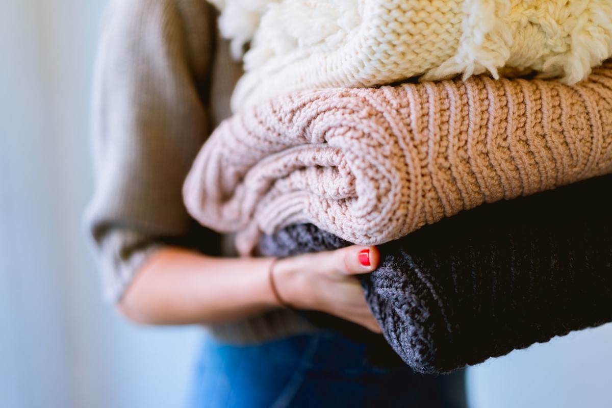 Person Carrying Clothing. Renting Wardrobe.