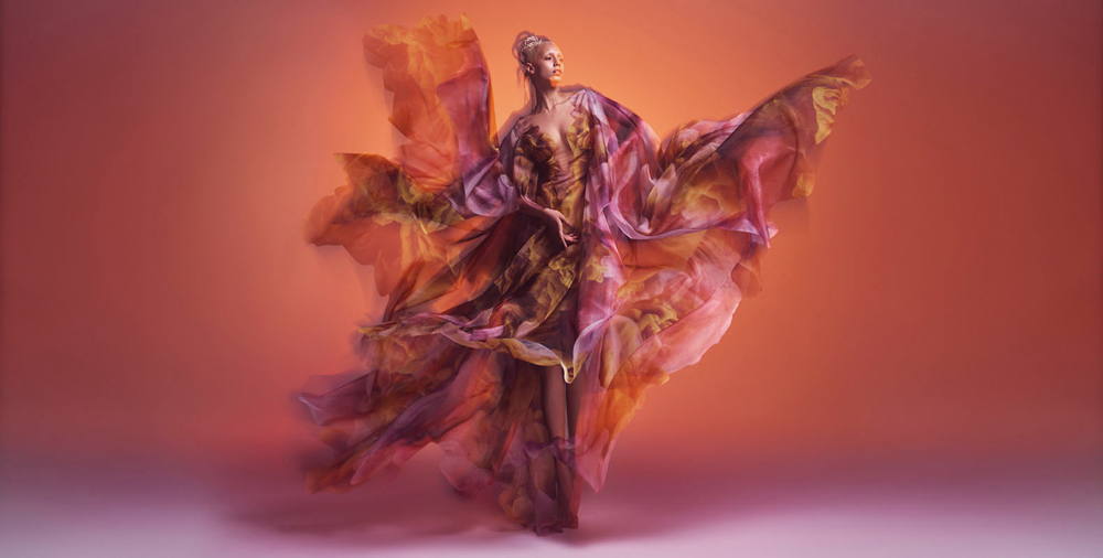 Iris van Herpen. Cosmica dress, Shift Souls collection, Haute Couture spring/summer 2019. Colored clouds by Kim Keever printed on translucent organza. Photo by Warren du Preez & Nick Thornton Jones. Model: Jazzelle