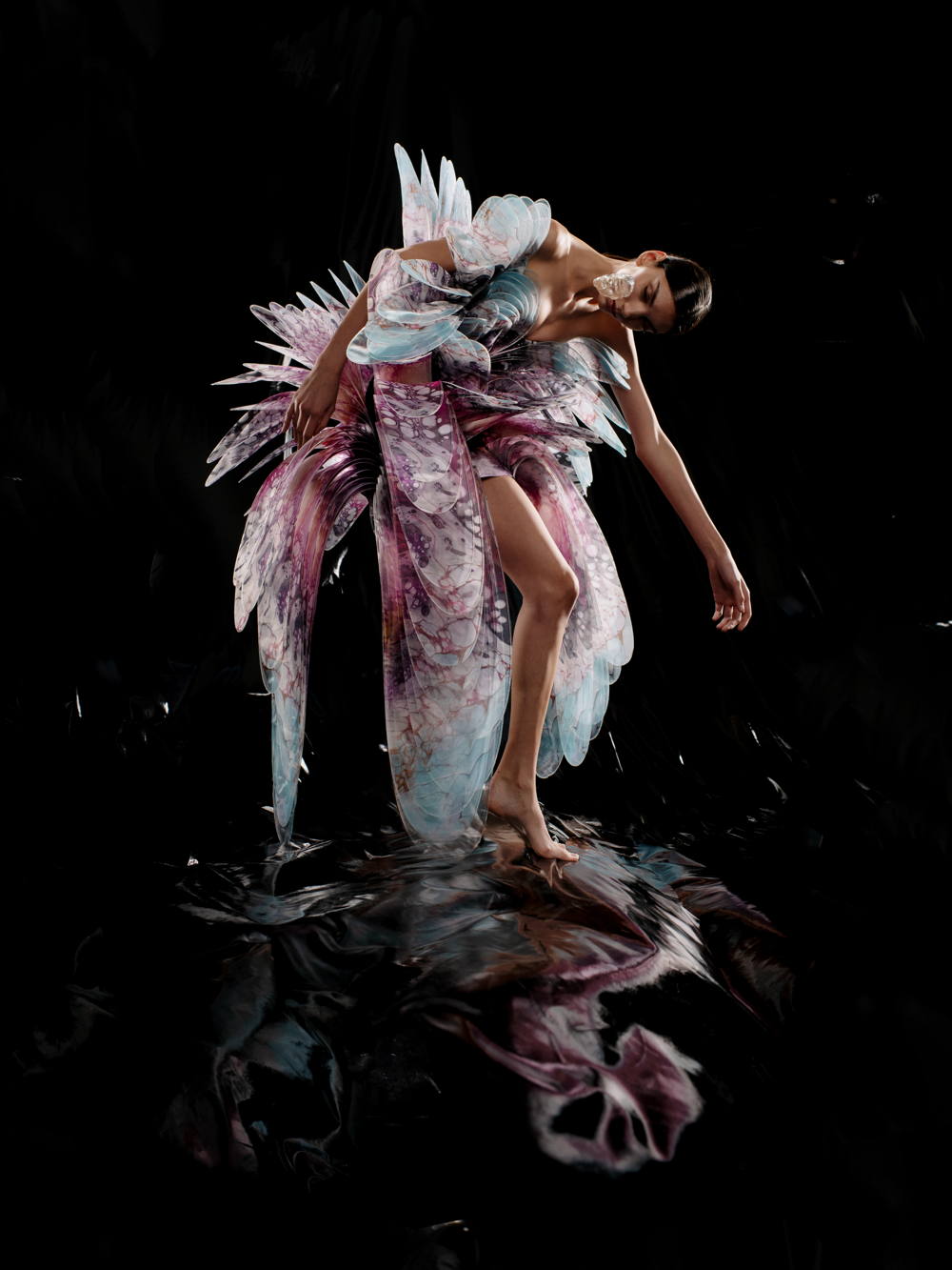 Iris van Herpen. Hydrozoa dress, Sensory Seas collection, Haute Couture spring/summer 2020. Cellular deep-sea aquarelles, oil painted by Shelee Carruthers, with 3D layered transparent lasercut PetG leaves. Photo by David Uzochukwu Model: Cynthia Arrebola.