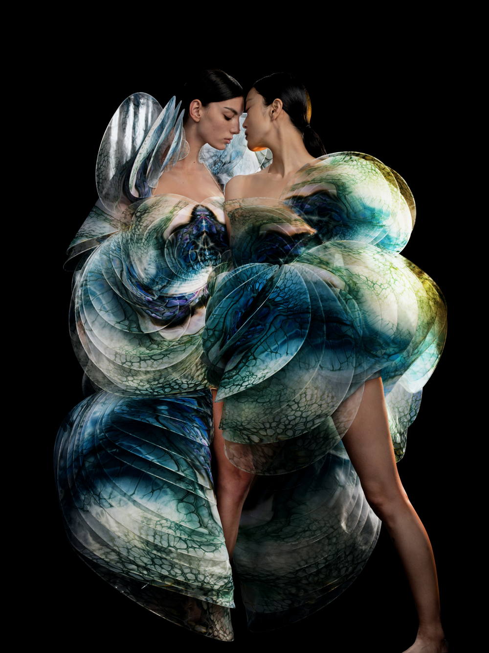 Iris van Herpen. Sensory Seas dress & Nautiloid dress, Sensory Seas collection, Haute Couture spring/summer 2020. Cellular deep-sea aquarelles printed to silk organza, oil painted by Shelee Carruthers. Photo by David Uzochukwu. Models: Cynthia Arrebola I Yue Han.