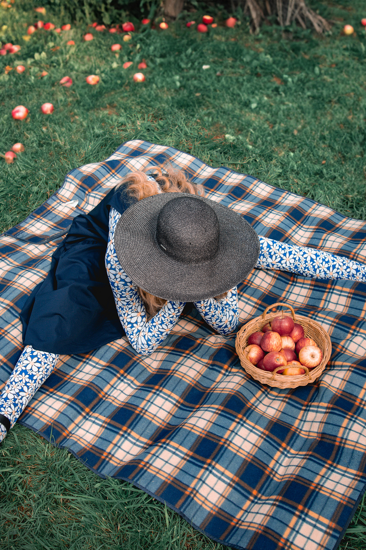 Model Sitting On Picnic Rug