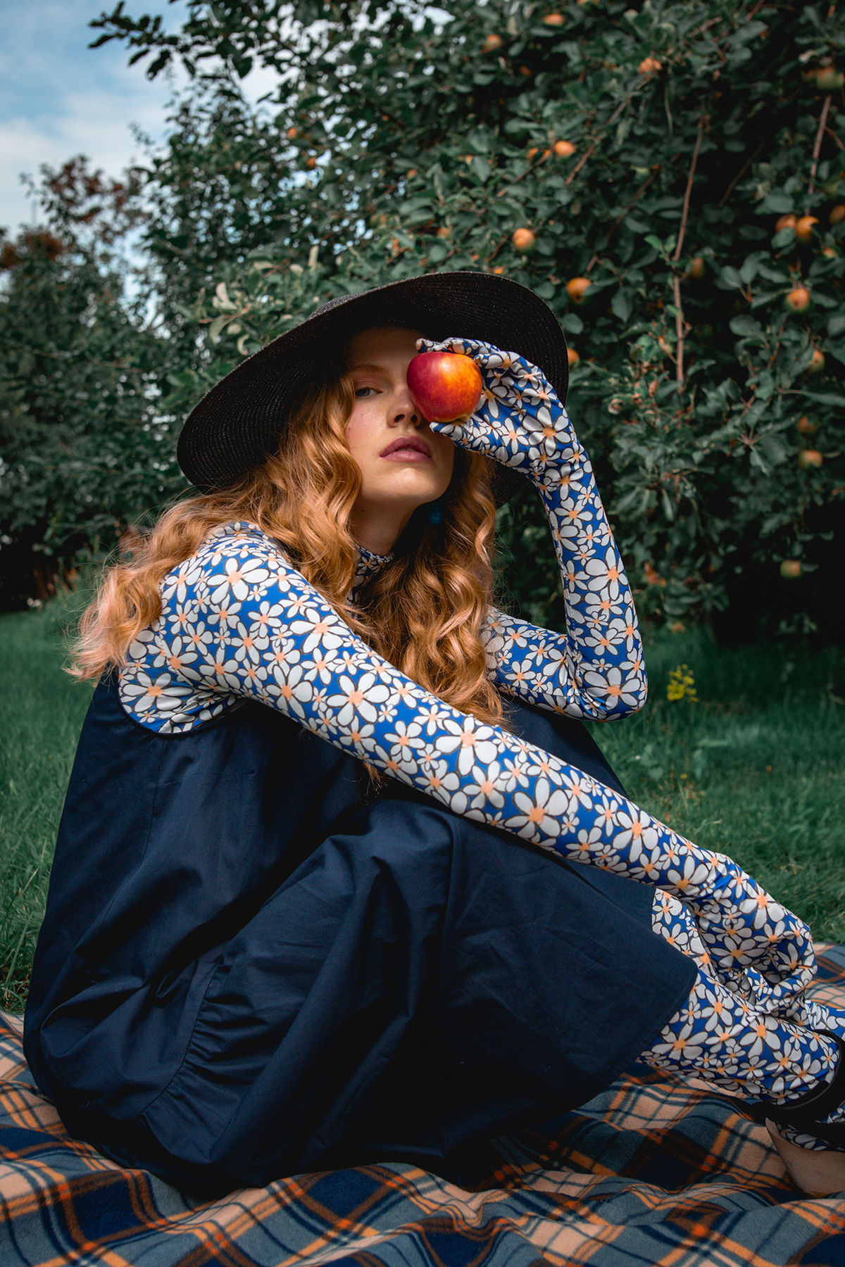 Model Holding An Apple