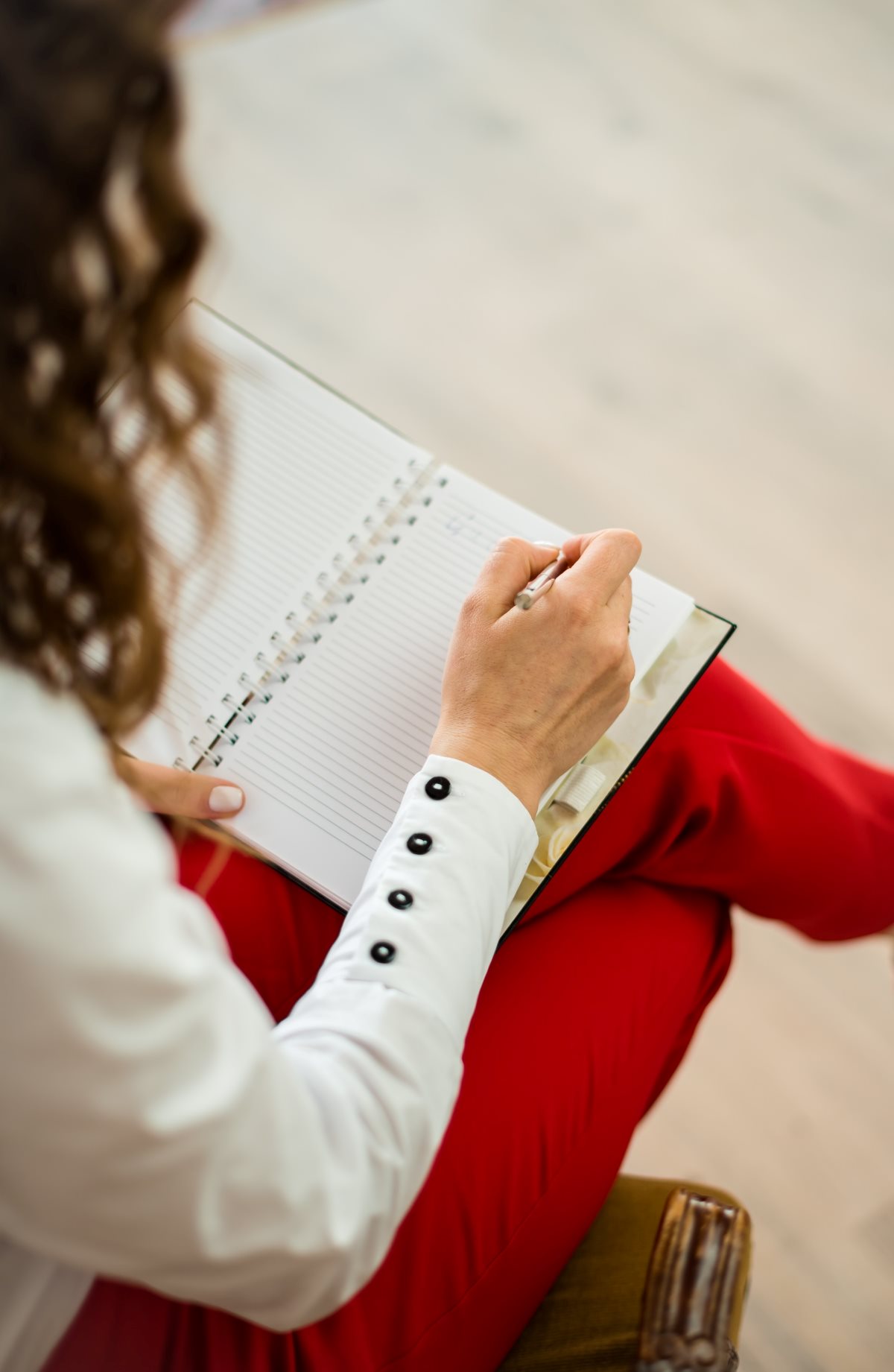 Person Writing In Notebook. Psychodermatology.