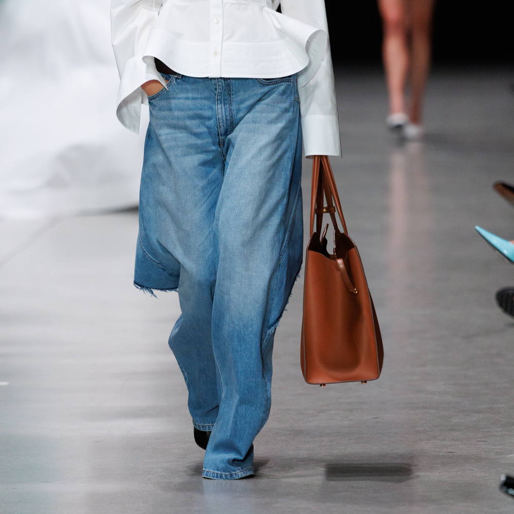 A model is catwalking Stella McCartney SS2026 show with Pure.Tech Jeans