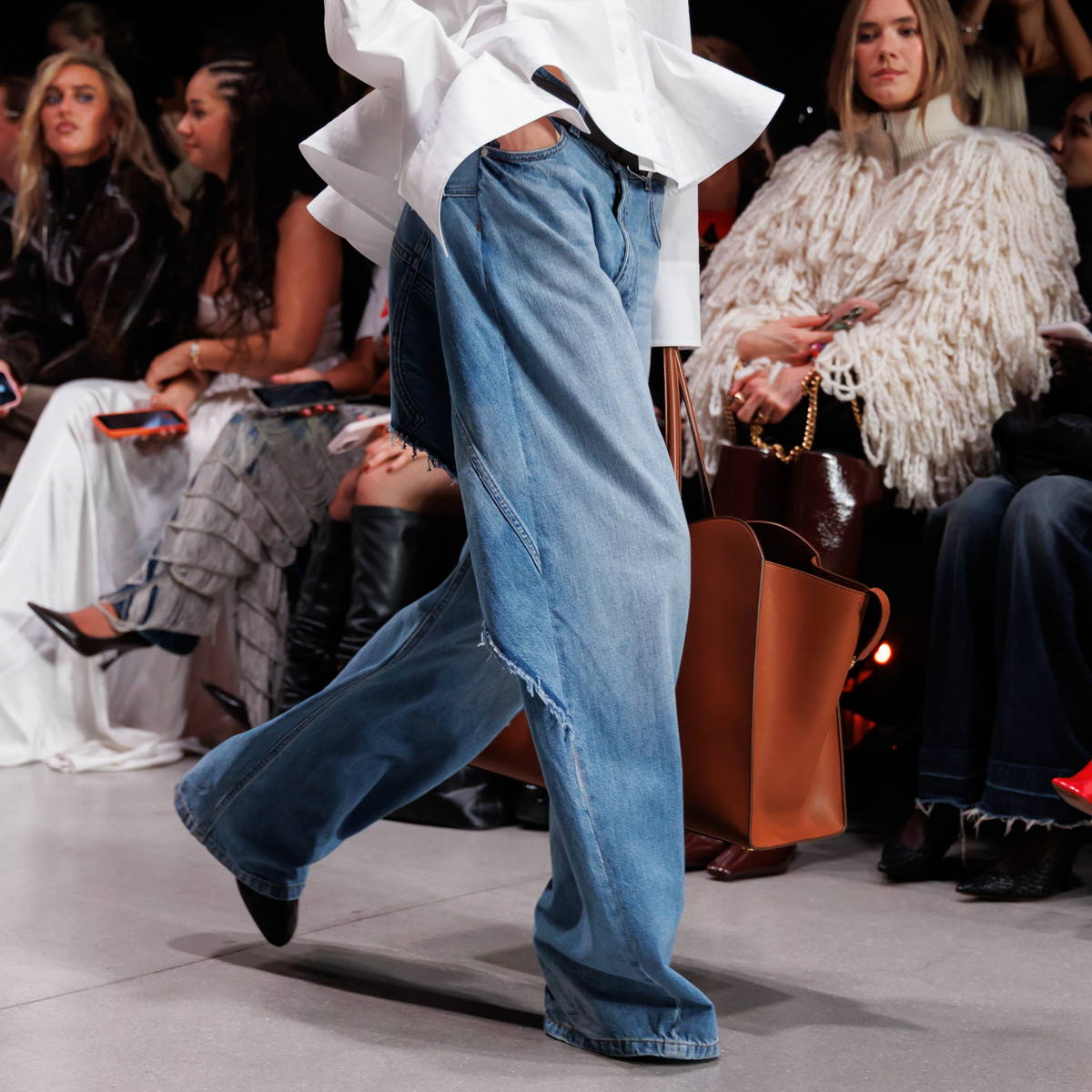 A model is catwalking Stella McCartney SS2026 show with Pure.Tech Jeans