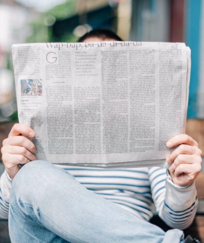 Person Reading News. Sustainability Recap 2023.