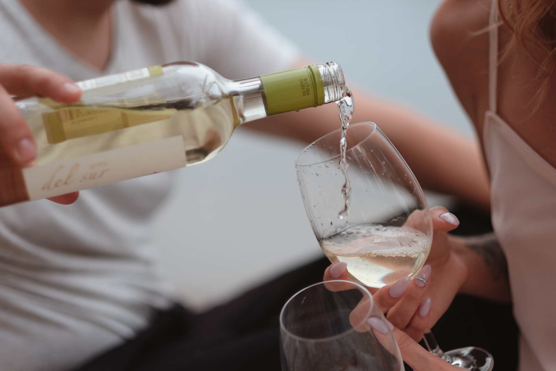 Wine Being Poured Into A Glass