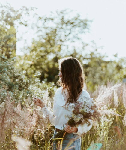 A women in a field full of flowers