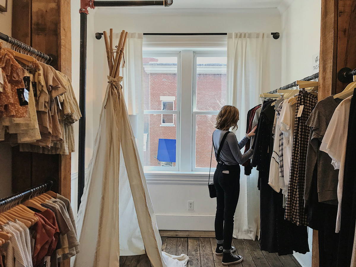 woman buying second hand kids clothes